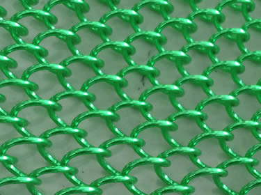 A piece of coil drapery wire mesh in apple green color