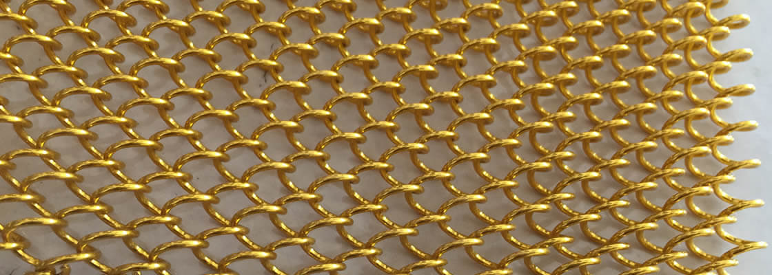 A piece of golden coil drapery mesh