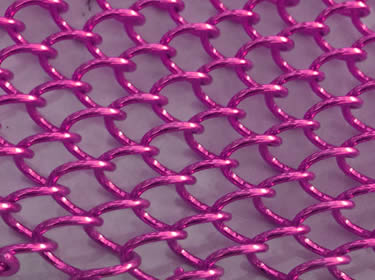 A piece of coil drapery wire mesh in pink color