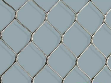 A detail picture of cable mesh on the blue background.