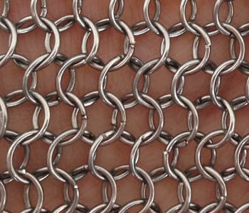 A piece of stainless steel chain braid ring mesh on white background